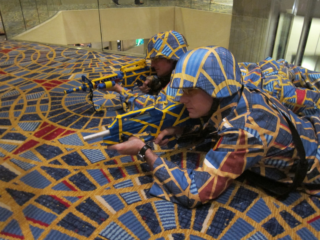 Cosplayers dressed in Marriott carpet camouflage